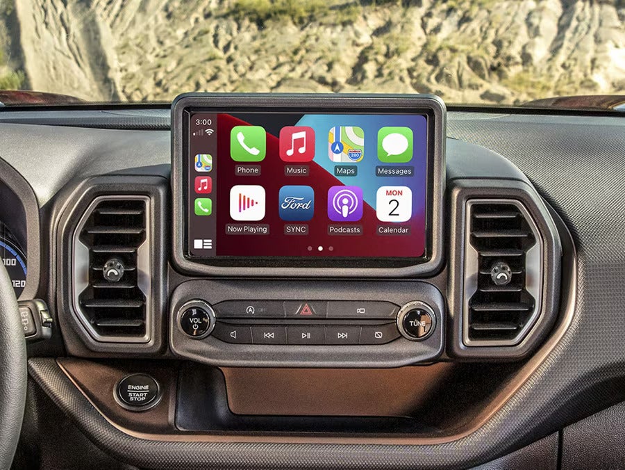 the interior of an suv showing the infotainment system